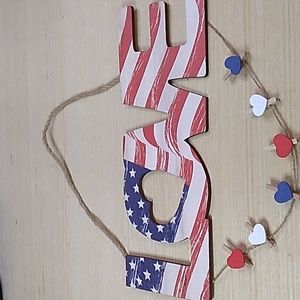 Wooden sign Love in red, white & blue. 11.5 x 4.5 inches w heart picture clips